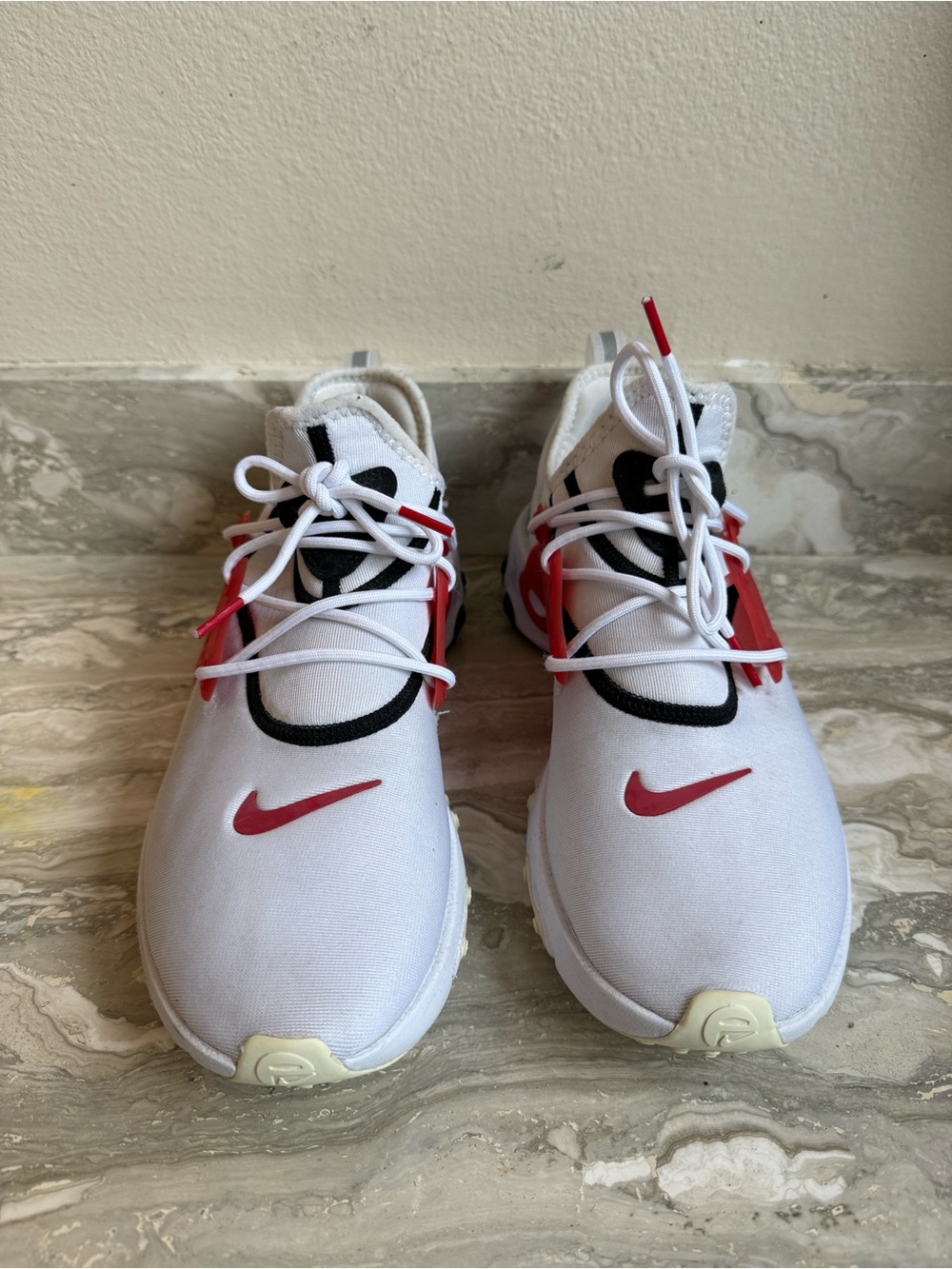 Nike React Presto White University Red sneakers.